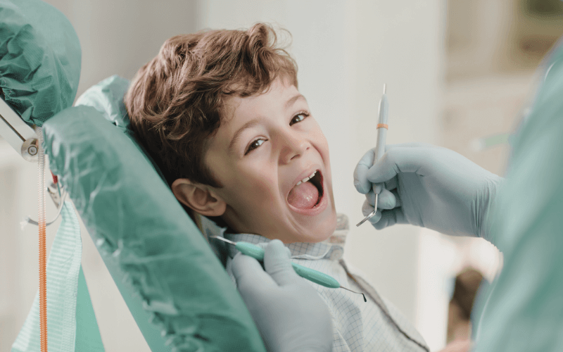 Young boy smiling during a dental appointment at family dentistry clinic in Mississauga