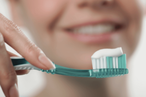 Close-up of a toothbrush with toothpaste - learn effective brushing techniques for a healthier smile.